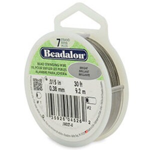 May include: A spool of Beadalon bead stringing wire, 0.015 in (0.38 mm) thick, in a clear plastic container with a hanging hook. The spool is labeled "Beadalon Bead Stringing Wire" and "Bright Brilliant Brillante".