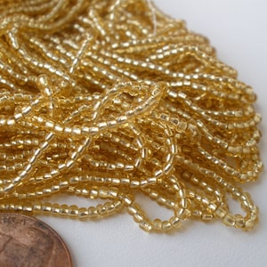 Czech Seed Beads 11/0 Pale Gold Silver Lined 10 str 20 in Hank