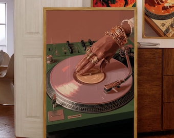 May include: Artwork depicting a hand with gold jewellery on a pink vinyl record. The record player is green, set against a pink backdrop, and framed in wood. Two further framed artworks with similar themes are visible.