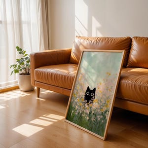 black kitten in daisy patch