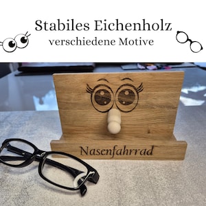 Hier wird ein Bild gezeigt auf dem Nasenfahrrad und Augen mit Wimpernaufschlag zu sehen.