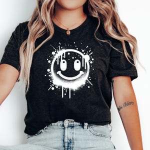 Retro Smiley Face Tee: Positive Vibes Spray Paint Design