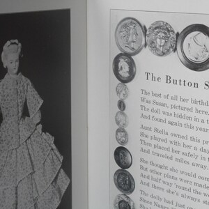 May include: A black and white photo of a doll wearing a dress. The doll is surrounded by buttons. The text "The Button String" is written above the buttons. The text below the buttons reads: "The best of all her birthday gifts Was Susan, pictured here. The doll was hidden in a trunk And found again this year."