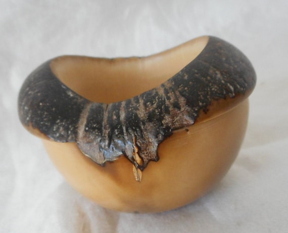 Turned from tagua nut (vegetable ivory) — a rare, sustainable material most people have never heard of, resulting in a tiny sculptural bowl with natural grain patterns unlike anything wood or ceramic.