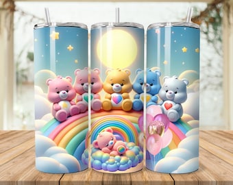 May include: Three stainless steel tumblers with Care Bears designs. Each tumbler features a different Care Bear character on a rainbow, with a blue sky background, clouds, and stars. The tumblers have a straw and a lid.