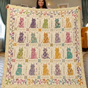 May include: A square quilt featuring a grid of twenty individual blocks, each displaying a cat silhouette in various floral patterns and colors. The quilt is bordered by a colorful pinwheel design and includes small paw print accents.