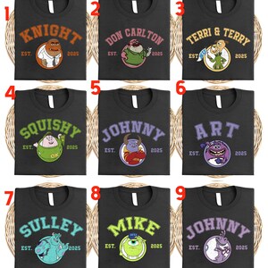 May include: Nine black t-shirts with different cartoon character designs. Each shirt features a character's name in a collegiate font, the year "2025", and the word "EST." The designs include various monsters and creatures.