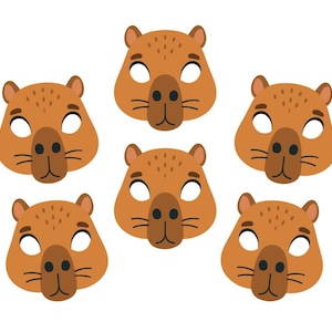 Puede incluir: Seis máscaras faciales de carpincho marrones con agujeros para los ojos blancos y narices negras están dispuestas sobre un fondo blanco. Las máscaras tienen orejas pequeñas y bigotes. Estas máscaras son adecuadas para una fiesta infantil o un disfraz.