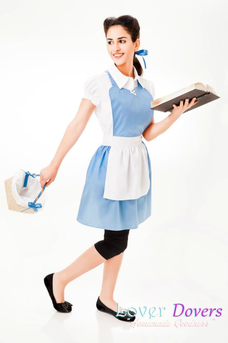 May include: A woman dressed as a maid in a blue and white dress and apron, holding a book and a basket. She is wearing black leggings and black shoes.