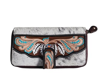 May include: A white and brown leather wallet with a zipper closure and a turquoise and brown floral design.
