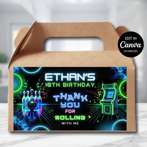 May include: A brown cardboard gable box featuring a rectangular label with a neon-style graphic. The label displays bowling pins, a bowling ball, and an arcade cabinet with text reading Ethan's 10th Birthday, Thank You For Rolling With Me.