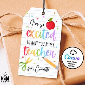 May include: A gift tag with the text "I'm so excited to have you as my teacher" in colorful lettering, featuring an apple, scissors, and a pencil. The tag is on a gift wrapped in brown paper and tied with twine.