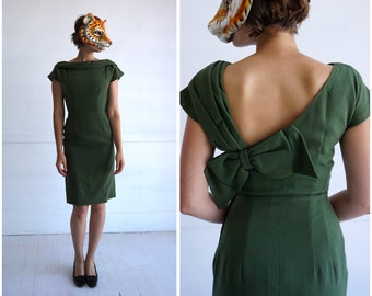 Vintage 60s Olive Green Wiggle Dress with Folded Boatneck and Dramatic Asymmetric Deep V Back w/ Oversized Bow | Small