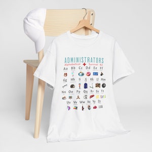 May include: White t-shirt featuring a graphic of the alphabet, each letter represented by an icon. The graphic is titled "Administrators Alphabetical Survival Kit".