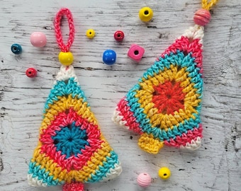 May include: Two triangular crochet ornaments featuring a multi-colored granny square pattern in shades of yellow, pink, and teal. Each ornament has a matching yarn loop at the top, a wooden bead accent, and is surrounded by loose colorful beads.