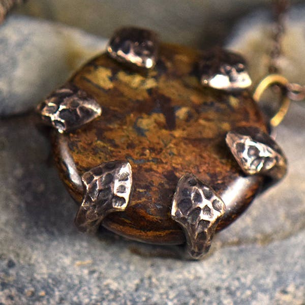Dragon Stone – Bronzite disc set in Bronze