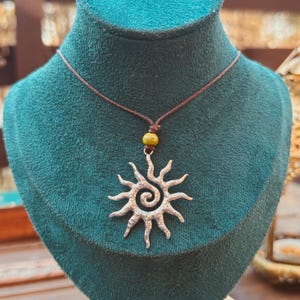 silver swirly spiral sun earthy pendant necklace brown cotton cord with  ceramic bead • handmade by me