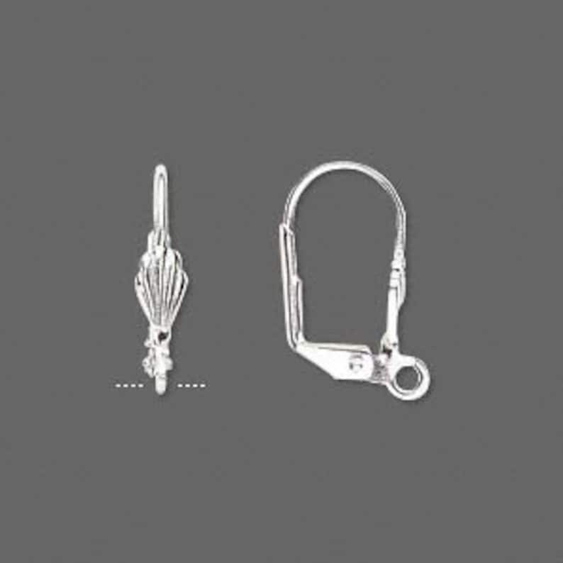 May include: Silver earring hook with a decorative design. The hook is open and has a small loop at the end.