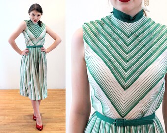Vintage 1950s full swing dress with rainbow stripes in chevron style pattern dolman sleeve