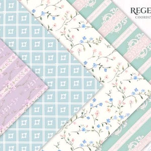 May include: An assortment of patterned papers in pastel colors. Designs include floral vines, stripes with floral accents, and geometric patterns. The text "REGENCY COORDINATING" is in the upper right corner. The papers are arranged at angles, showcasing the variety of designs.