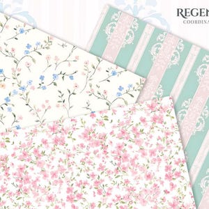 May include: Assortment of patterned papers featuring floral and striped designs. One paper has a white background with blue and pink flowers. Another has pink flowers on a white background. The third has stripes and floral accents.