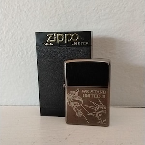 Vintage zippo lighter from 2001.  New in box, lighter is still sealed.  Statue of Liberty design.