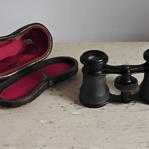 Opera glasses /theater binoculars made of brass.  Small size, very good condition.  Only 4&quot; x 3&quot;.