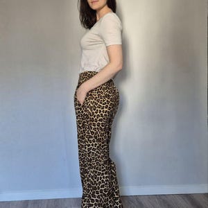 Palazzo-broek met luipaardprint: katoenen broek met hoge taille en wijde pijpen