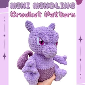 May include: A handmade purple crochet plushie with a light purple body and darker purple accents. The plushie has a detailed design with a face, ears, arms, and a tail. The text "MINI MINDLING Crochet Pattern" is at the top, and "@peachypairplushies" is at the bottom.