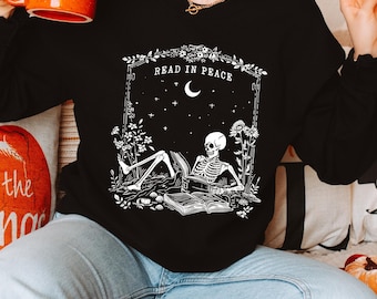 Read in Peace Sweatshirt, Skeleton Reading Book Lover Hoodie, Bookish Halloween Shirt for Spooky Season,Book Lover Halloween Sweatshirt