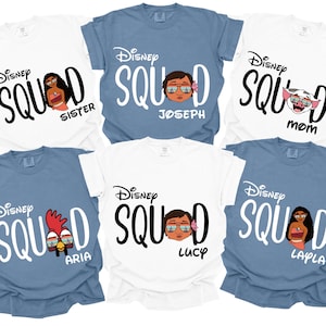 May include: A collection of white and blue t-shirts with the text "Disney Squad" and character illustrations. Each shirt has a different name: Sister, Joseph, Mom, Aria, Lucy, and Layla. The shirts are short-sleeved.