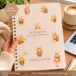 May include: A spiral-bound planner titled My Busy Bee Creator Planner with a light cream cover featuring multiple watercolour illustrations of cartoon bees, flowers, and hearts, with text indicating 140 pages and daily, weekly, and monthly planning.