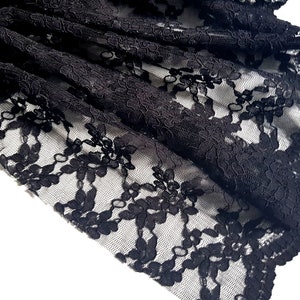 Black corded lace fabric with scalloped edge. 53&quot; wide. Great for bridalwear and occasionwear.