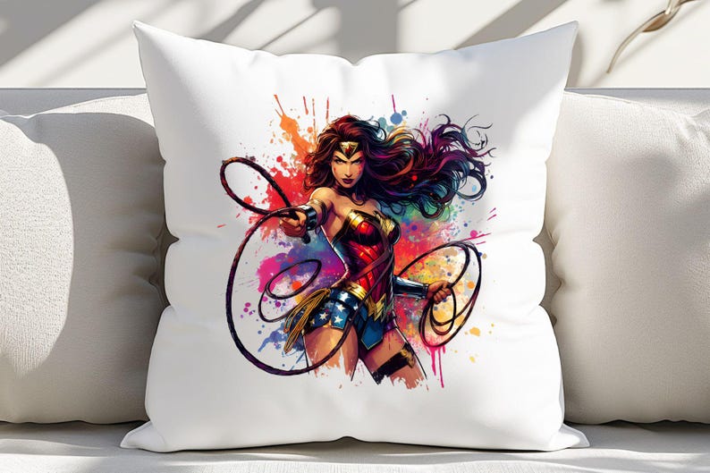 May include: White throw pillow featuring a vibrant illustration of Wonder Woman. The artwork showcases Wonder Woman in her iconic costume, with a dynamic pose and colorful paint splatter background. The pillow is a decorative item.