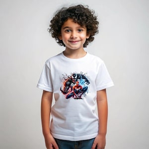 May include: A white t-shirt featuring a graphic print of Venom and Spider-Man in a dynamic pose. The print is in a black and red colour scheme with a splash of blue and white.