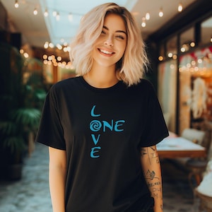 May include: A black t-shirt with a blue graphic design that reads "LOVE ONE" with a swirl design in the "O".