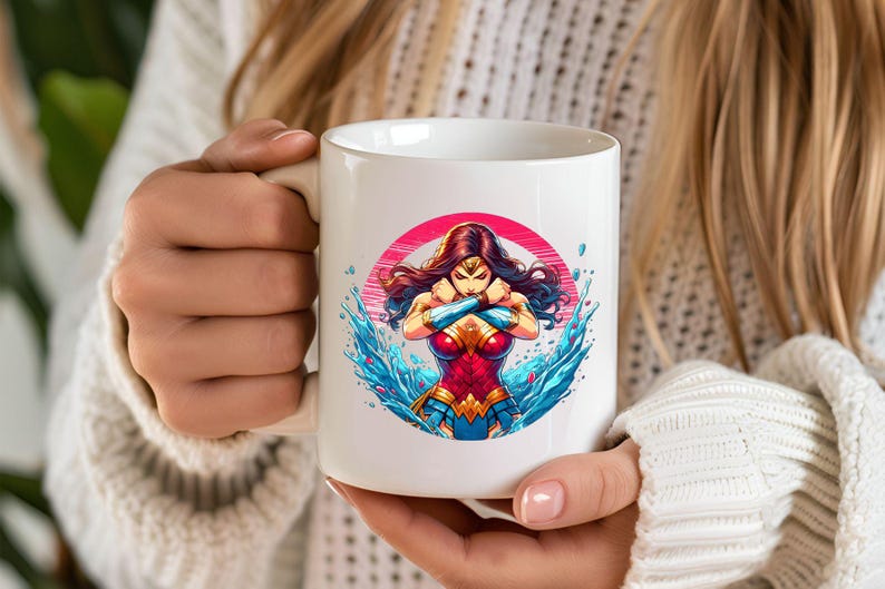 May include: White ceramic mug with a colorful illustration of Wonder Woman standing in water. The illustration is surrounded by a pink circle.