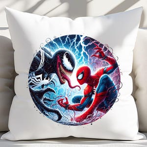 May include: A white pillow featuring a colourful illustration of Spider-Man and Venom battling. The image is set against a blue and purple background with lightning bolts.