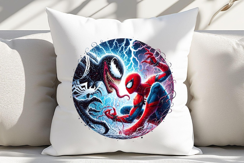 May include: A white pillow featuring a colourful illustration of Spider-Man and Venom battling. The image is set against a blue and purple background with lightning bolts.