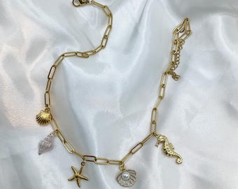 Stainless steel starfish and seashell charm necklace, ideal for a birthday or Valentine's Day gift