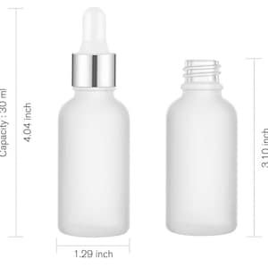 May include: Two frosted glass bottles. One has a dropper with a silver collar and a white tip. The other bottle is empty. The dropper bottle is 4.04 inches tall, 1.29 inches wide, and has a capacity of 30 ml.