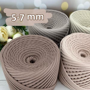 May include: Three spools of yarn in different shades of brown. The yarn is 5-7 mm thick.
