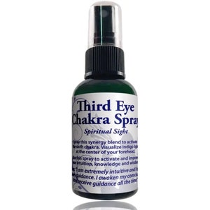 May include: A green glass bottle with a black spray top and a white label that reads "Third Eye Chakra Spray Spiritual Sight". The label has text describing the use of the spray to activate the sixth chakra.