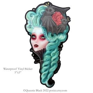 May include: Waterproof vinyl sticker featuring a woman with teal hair and a black bat perched on her head. The woman has red lips and a black choker. The sticker is 5 inches by 3 inches.