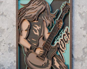 May include: A layered wooden wall art piece depicting a long-haired musician playing a guitar. The artwork features a brown frame, a teal background, and the words "Just Rock". The musician is in shades of brown and gray.
