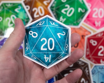 May include: A blue twenty-sided die with white numbers and a textured surface. The die is being held in a hand.