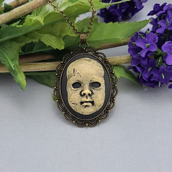 Scary Doll Face Creepy Baby Doll Cameo in Antiqued Brass Frame Necklace Pendant.