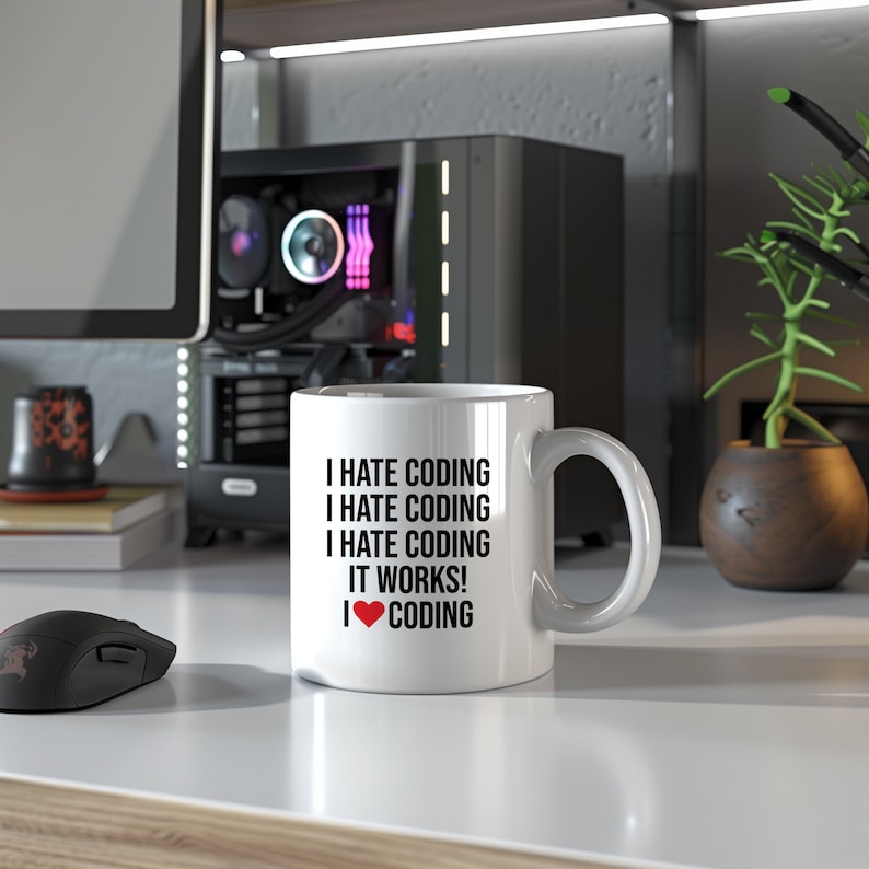 0.33L mug featuring the witty phrase "I hate coding, it works, I love coding"