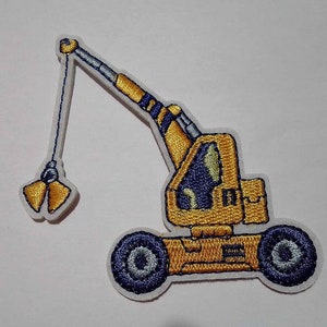 May include: Yellow embroidered iron-on patch of a crane with a blue cab and a yellow hook. The crane has two blue wheels.