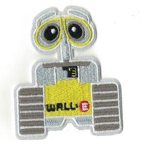 May include: An embroidered patch featuring WALL-E, the robot from the Disney Pixar film. The patch is yellow, grey, and white with a red letter "E" on the robot's chest.